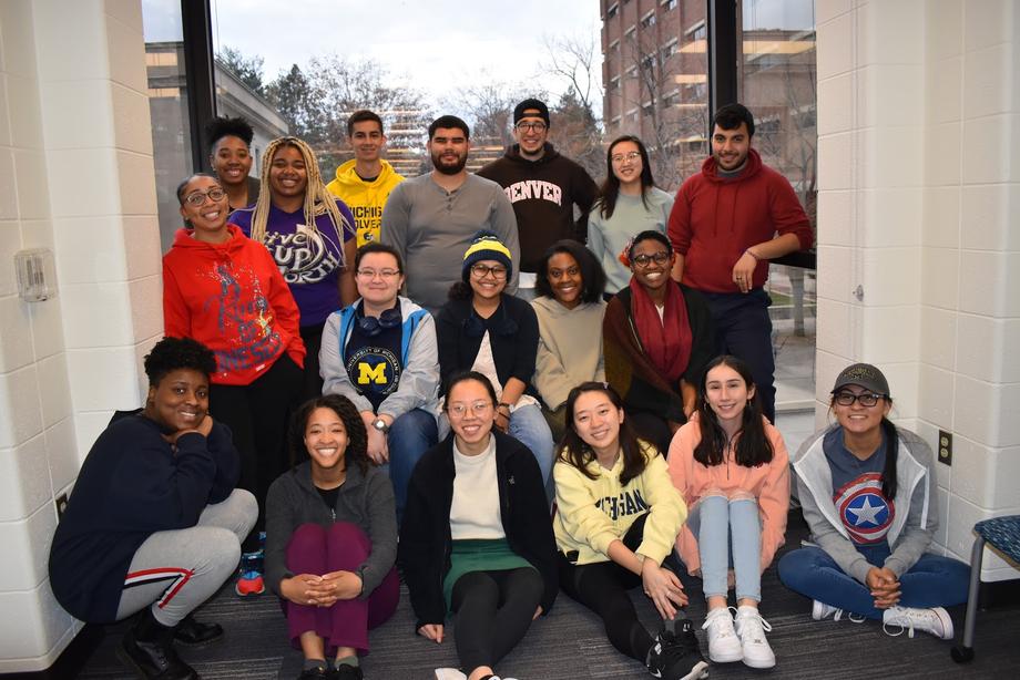 Students who work as peer information consultants pose together in Shapiro Library