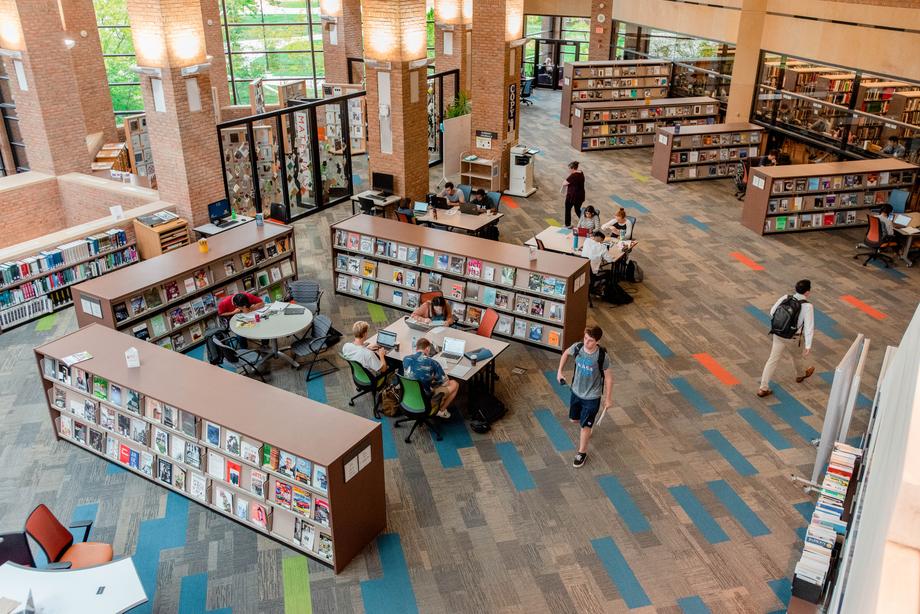 Aerial view of stacks, seating, and students in the Art, Architecture, and Engineering Library.