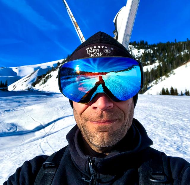 A picture of craig skiing on Mount Hood in Oregon. Well, not exactly skiing but on the mountain with skis, ready to make it happen.